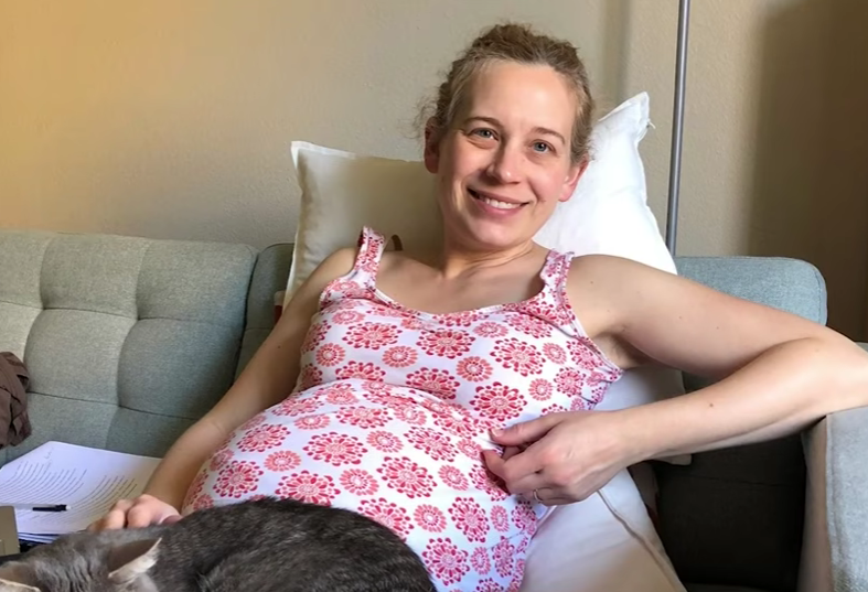 Mother holding newborn child illustrating multitasking and emotional bonding